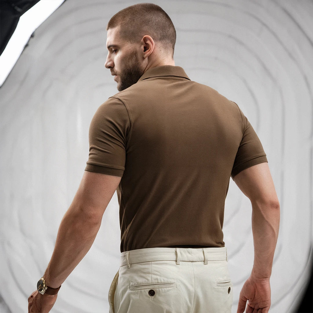 A man wearing a brown French Polo T-Shirt with short sleeves, a collar, and button-up neck.