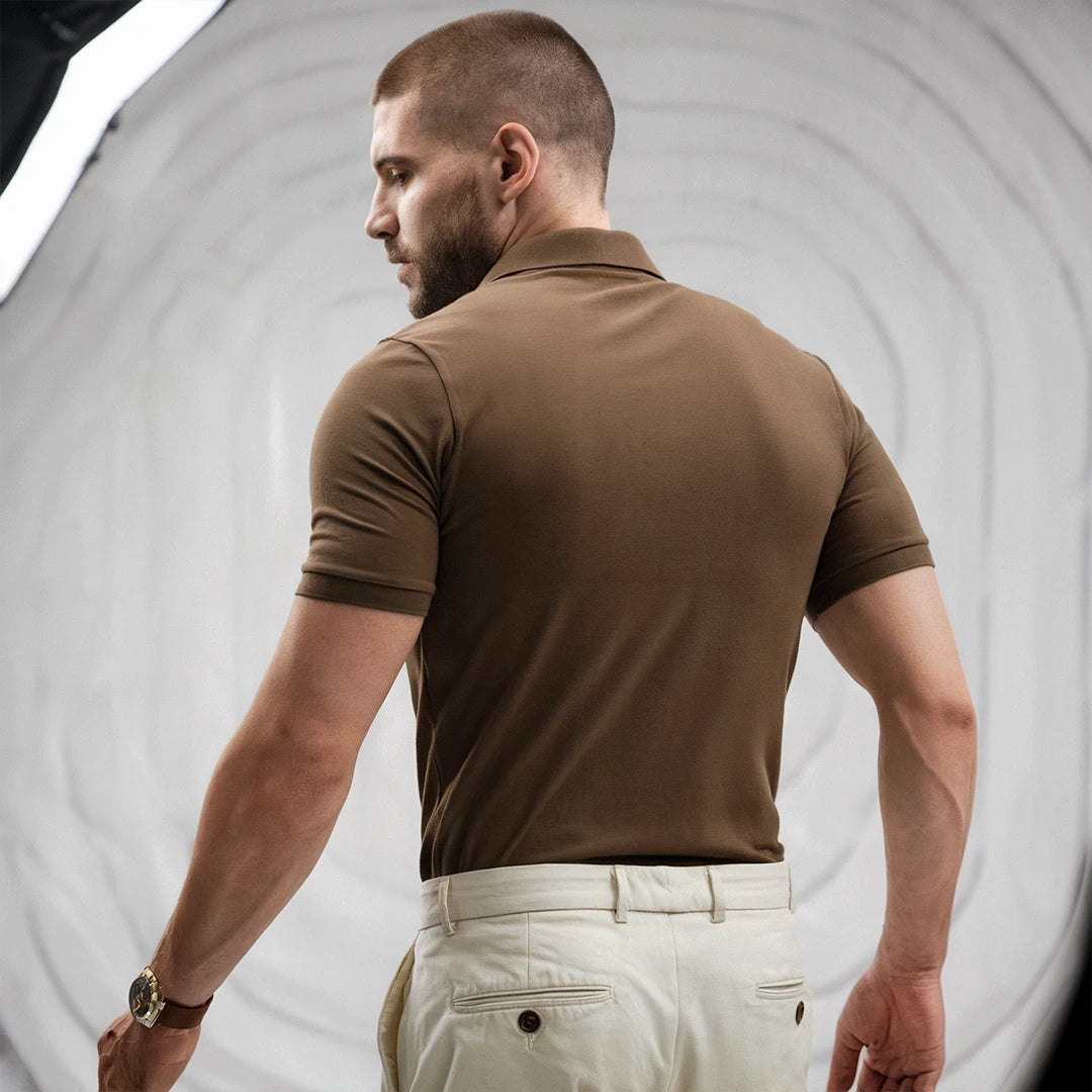 A man wearing a brown French Polo T-Shirt with short sleeves, a collar, and button-up neck.